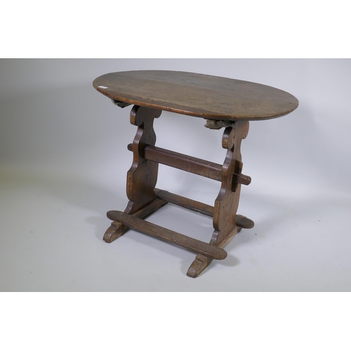 1133 - A C19th French oak trestle table, 66 x 90cm, 72cm high