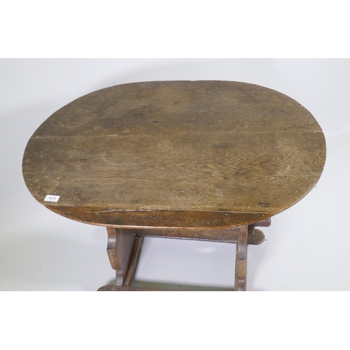 1133 - A C19th French oak trestle table, 66 x 90cm, 72cm high