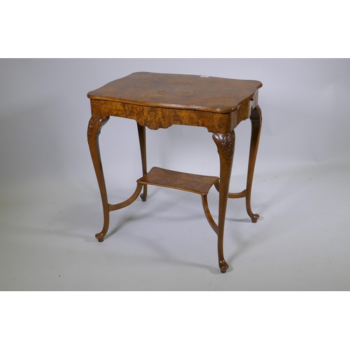 1128 - A burr walnut centre table, with shaped top and pull out slides, raised on carved cabriole supports ... 