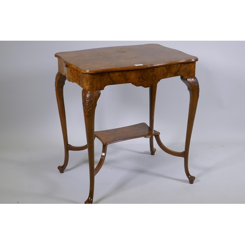 1128 - A burr walnut centre table, with shaped top and pull out slides, raised on carved cabriole supports ... 