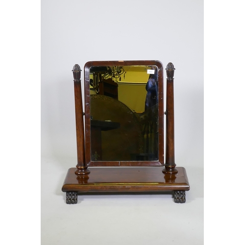 1131 - A C19th mahogany swing toilet mirror with tapering supports and original silvered glass, raised on p... 