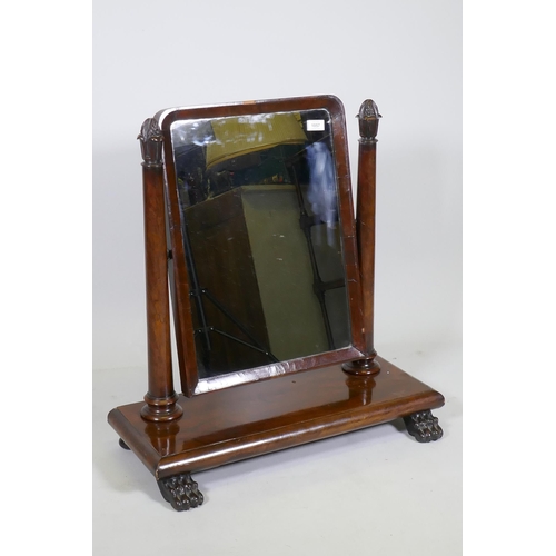 1131 - A C19th mahogany swing toilet mirror with tapering supports and original silvered glass, raised on p... 