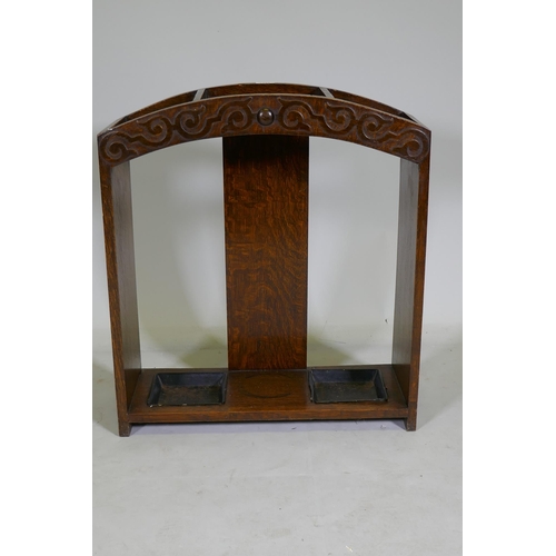 1186 - An Art Deco oak stick stand with carved decoration, 68 x 23 x 62cm