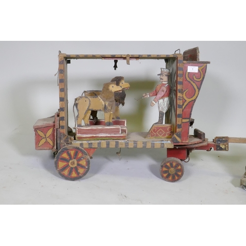 1 - A C19th Folk Art scratch built circus wagon with lions and lion tamer, with moving limbs operated by... 