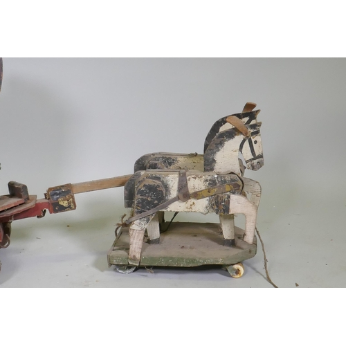 1 - A C19th Folk Art scratch built circus wagon with lions and lion tamer, with moving limbs operated by... 