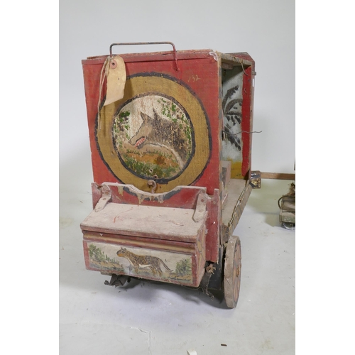 1 - A C19th Folk Art scratch built circus wagon with lions and lion tamer, with moving limbs operated by... 