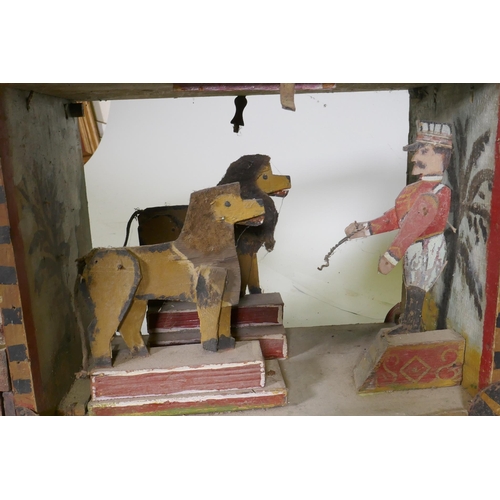 1 - A C19th Folk Art scratch built circus wagon with lions and lion tamer, with moving limbs operated by... 