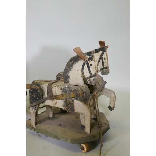 1 - A C19th Folk Art scratch built circus wagon with lions and lion tamer, with moving limbs operated by... 