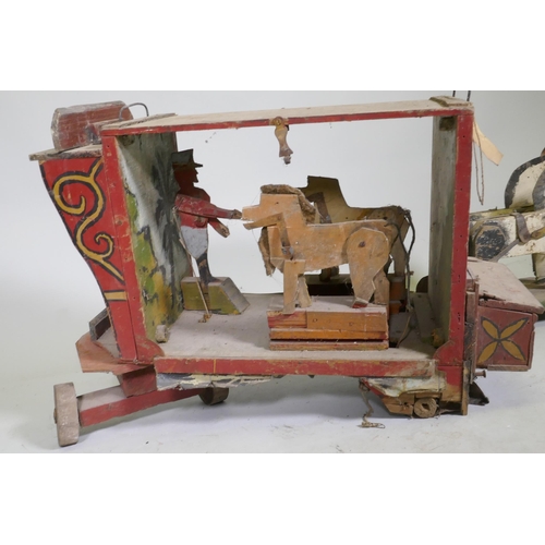 1 - A C19th Folk Art scratch built circus wagon with lions and lion tamer, with moving limbs operated by... 