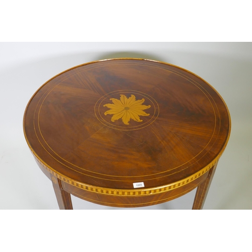 1005 - A marquetry inlaid figured mahogany centre table, with banded frieze top, raised on square tapering ... 