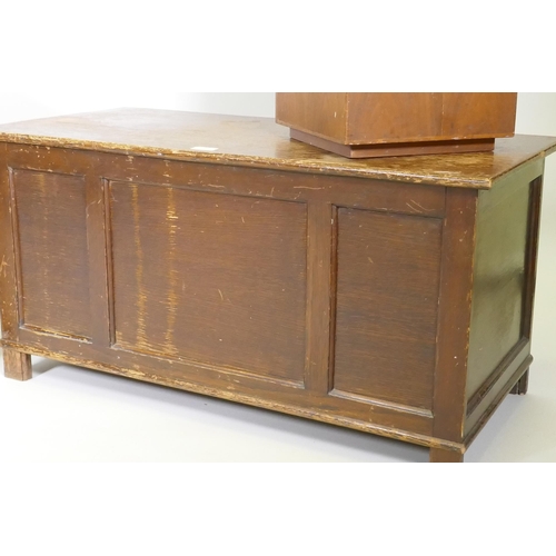 1006 - An oak veneered triple panel coffer raised on stile supports, 88 x 44 x 46cm, together with a fruitw... 