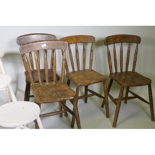 1007 - Four Windsor stick back kitchen chairs with elm seats, and three painted stools