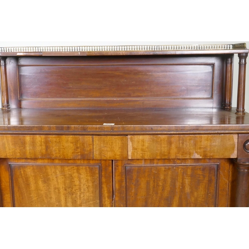 1017 - A C19th mahogany chiffonier, the top shelf with three quarter pierced brass gallery, over a base wit... 