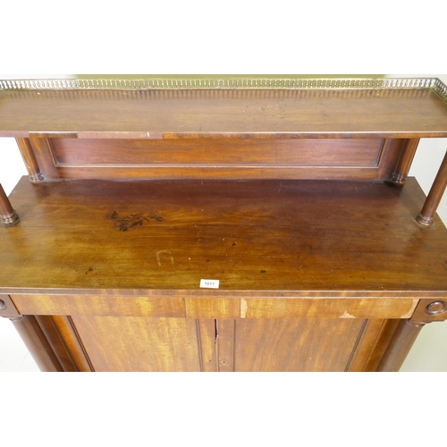 1017 - A C19th mahogany chiffonier, the top shelf with three quarter pierced brass gallery, over a base wit... 