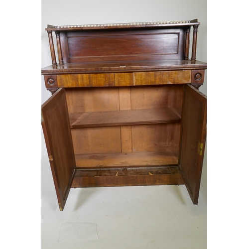 1017 - A C19th mahogany chiffonier, the top shelf with three quarter pierced brass gallery, over a base wit... 