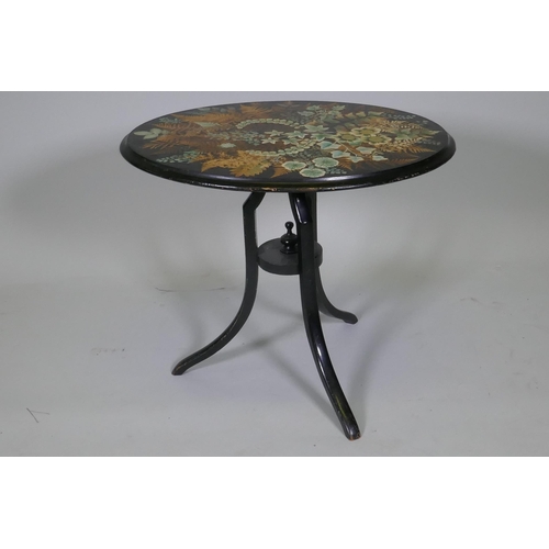 1020 - A Victorian ebonised tilt top occasional table with painted and stencilled fern decorated top, 51cm ... 