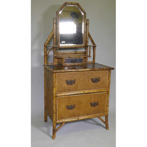 1026 - A Victorian Aesthetic oriental style bamboo and lacquer dressing table with swing mirror and three d... 