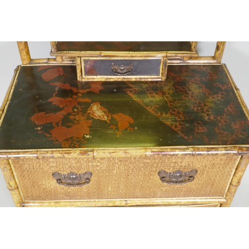 1026 - A Victorian Aesthetic oriental style bamboo and lacquer dressing table with swing mirror and three d... 