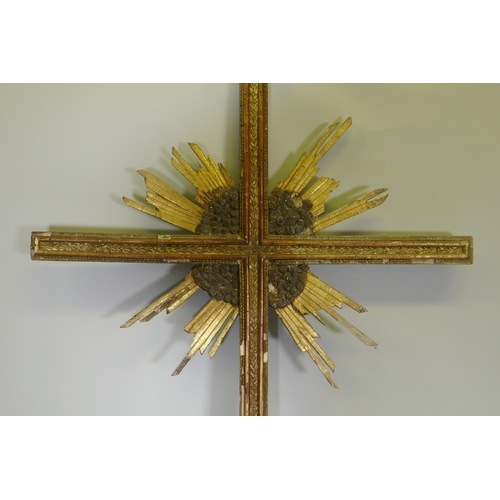 1033 - A continental giltwood and polychrome processional crucifix, with carved and moulded detail retainin... 