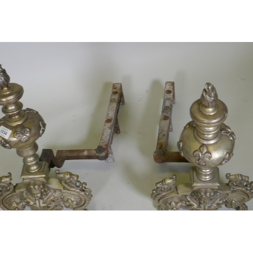 1034 - A pair of C19th French silver plated andirons, with fleur de lys and dragon mask decoration, 50cm hi... 