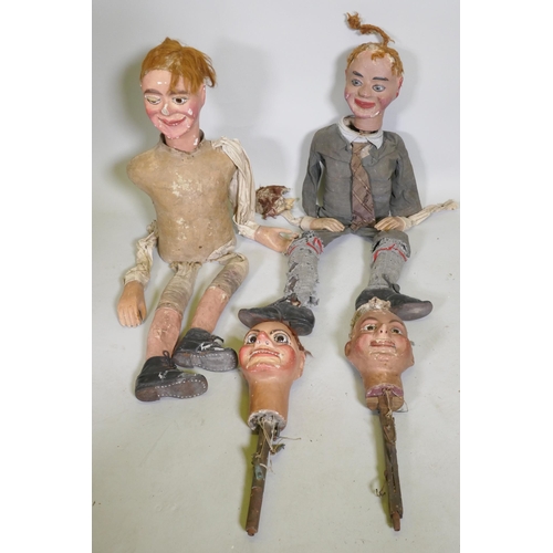 104 - Four early C20th ventriloquist's dummy heads, paper mache with glass eyes, and two associated bodies... 