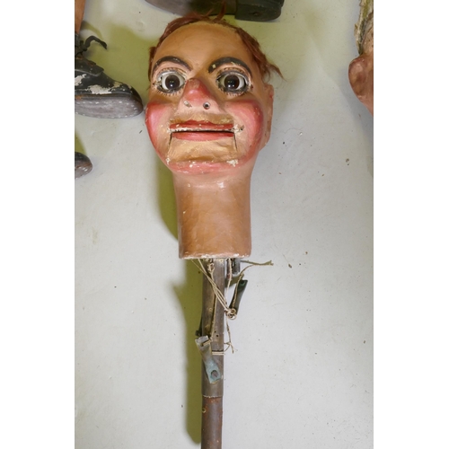 104 - Four early C20th ventriloquist's dummy heads, paper mache with glass eyes, and two associated bodies... 