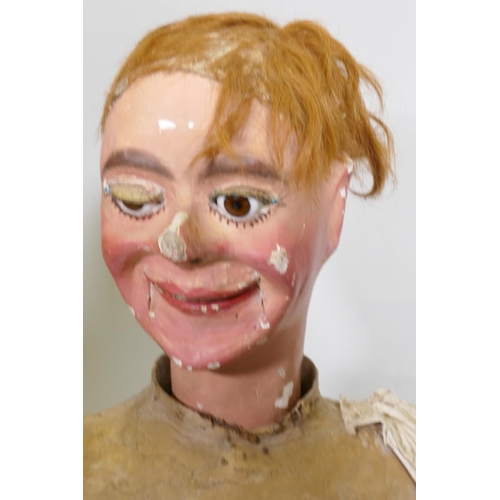 104 - Four early C20th ventriloquist's dummy heads, paper mache with glass eyes, and two associated bodies... 