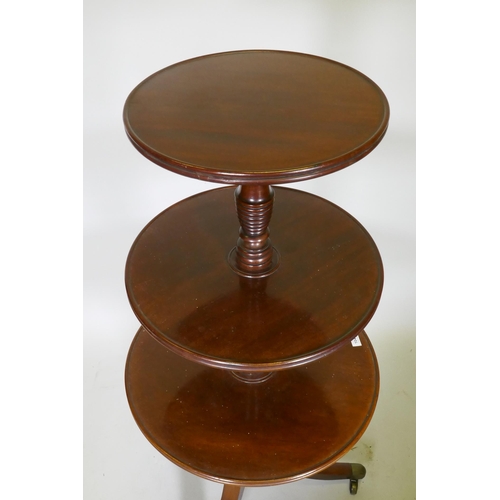 1041 - A Georgian mahogany dumb waiter with three revolving tiers, each united by a 'beehive' style ring co... 