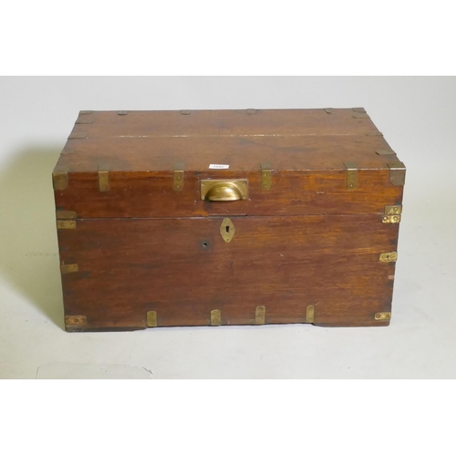 1042 - A C19th campaign teak chest, with brass mounts and carrying handles, the interior fitted with a lift... 