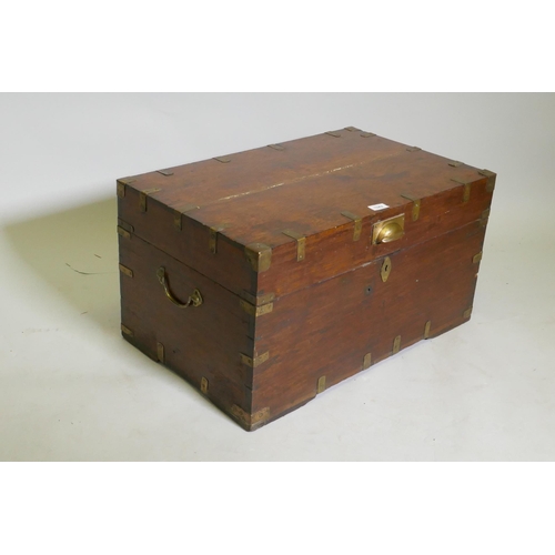 1042 - A C19th campaign teak chest, with brass mounts and carrying handles, the interior fitted with a lift... 