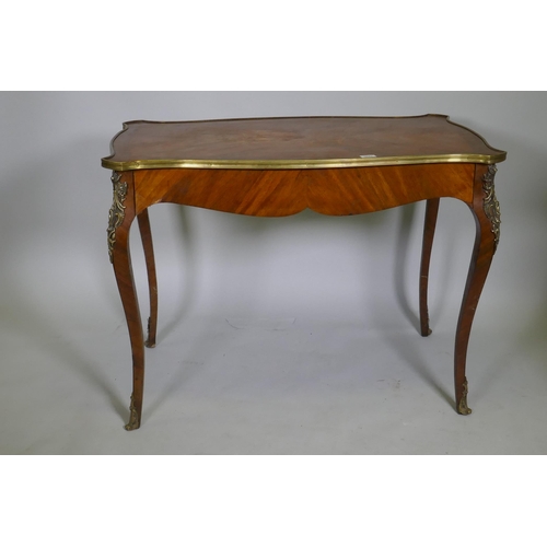 1043 - A French marquetry inlaid side table, with shaped top and brass mounts and single frieze drawer, rai... 