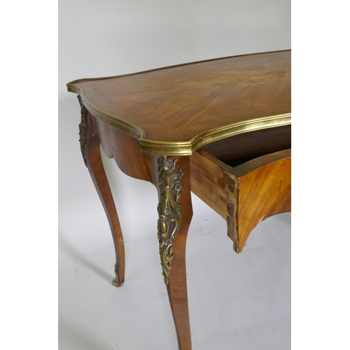 1043 - A French marquetry inlaid side table, with shaped top and brass mounts and single frieze drawer, rai... 