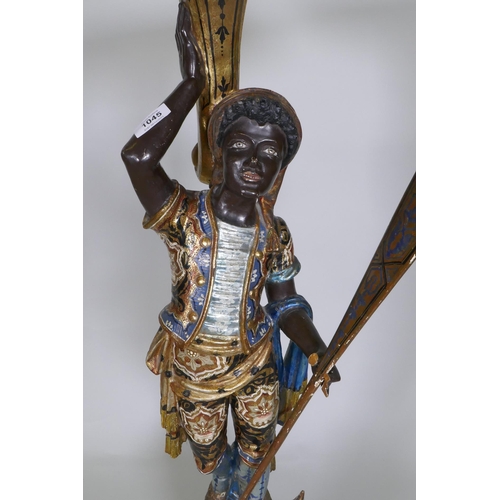 1045 - A Venetian polychrome and parcel gilt blackamoor stand in the form of a gondolier, 102cm high