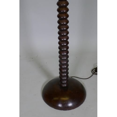 1047 - A bobbin turned mahogany standard lamp with chrome mounts, 142cm high