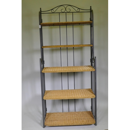 1049 - A folding metal pot rack with five wicker shelves, 80 x 42 x 186cm