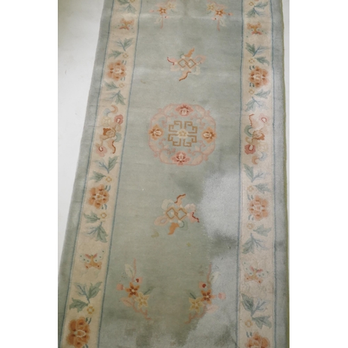 1059 - A Chinese wool runner, 86 x 317cm