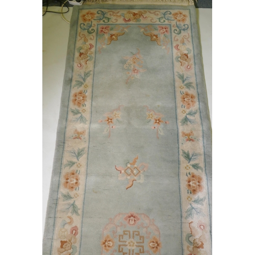 1059 - A Chinese wool runner, 86 x 317cm