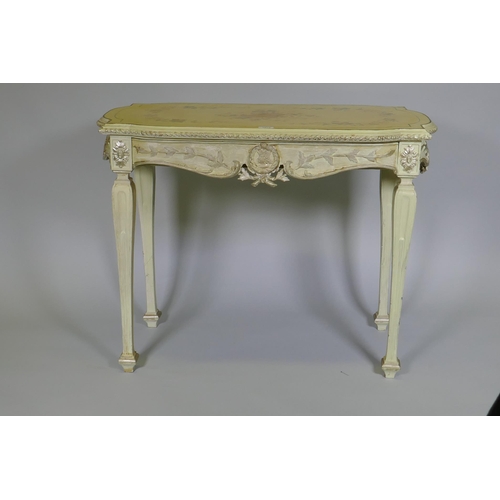 1074 - An Italian painted pine and parcel gilt side table, the shaped top with painted floral decoration an... 