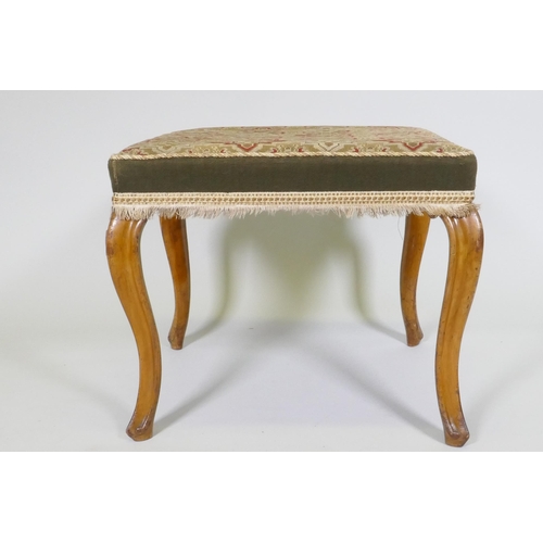 1076 - A Victorian walnut stool with tapestry cover, raised on cabriole supports, 53 x 53 x 46cm