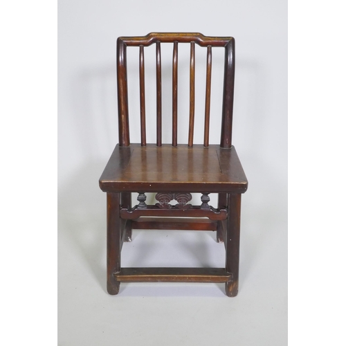 1091 - An antique Chinese elm spindle back low chair, 72cm high