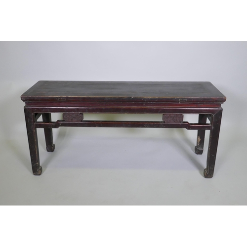 1094 - A Chinese hardwood low table, 109 x 34cm 50cm high