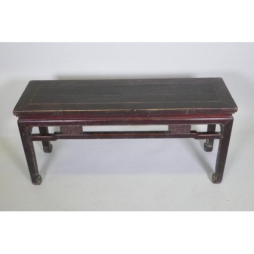 1094 - A Chinese hardwood low table, 109 x 34cm 50cm high