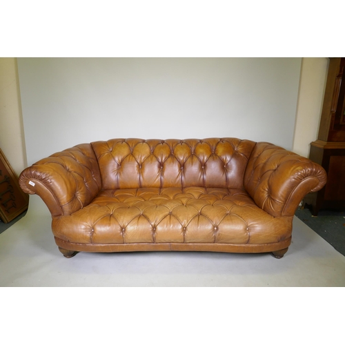 1101 - A Tetrad Oskar deep buttoned tan leather sofa, 200cm wide