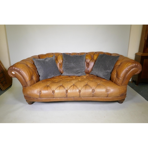 1101 - A Tetrad Oskar deep buttoned tan leather sofa, 200cm wide