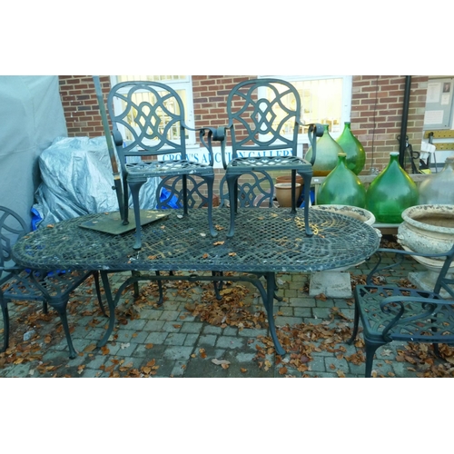 1105 - A painted aluminium extending garden table and six chairs