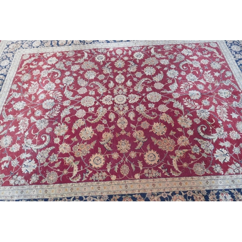 1108 - A good quality deep pile silk and wool carpet with Persian inspired design