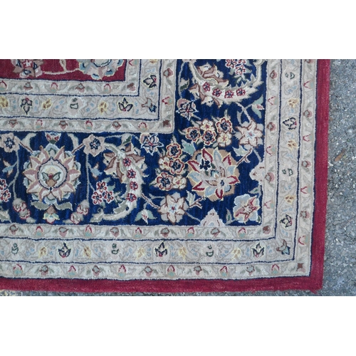 1108 - A good quality deep pile silk and wool carpet with Persian inspired design