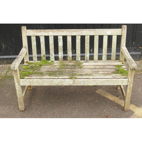 1109 - A weathered teak garden bench