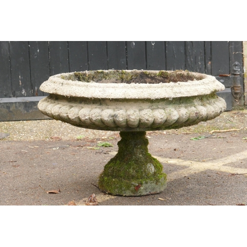 1111 - A vintage reconstituted stone urn on column base, 78cm diameter