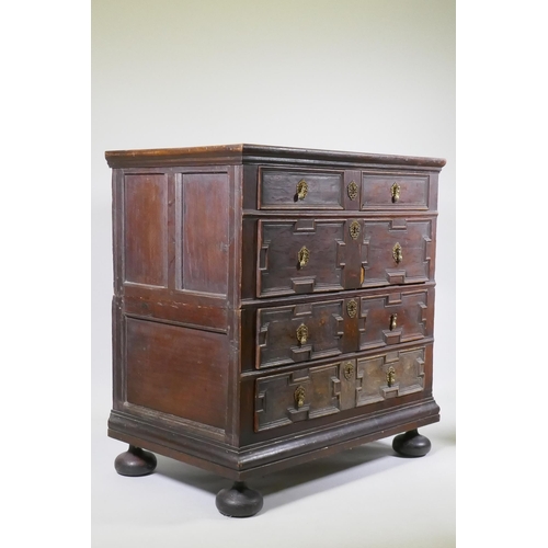 1126 - A late C17th/early C18th oak garret chest of four drawers, raised on bun feet, with adaptions, 95 x ... 